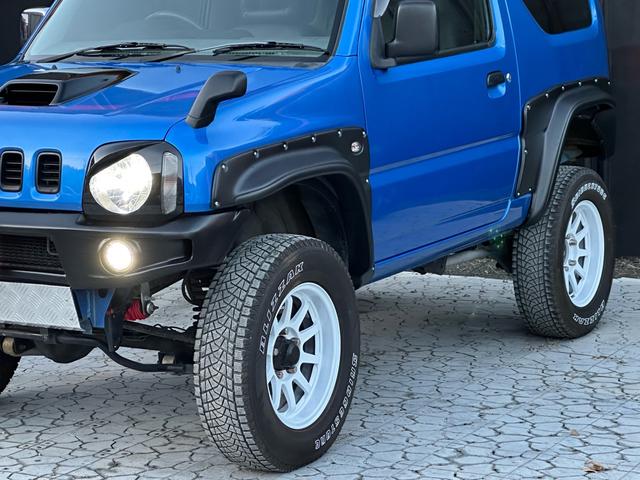 ジムニー XC 【1年間走行無制限保証】5MT/フルカスタム車両(エアロ・2本出しマフラー・スキッドプレート・リフトアップ・ブリスターフェンダー・LEDテール・シートカバー・アルミホイール・ヘッドライトカバー)(50枚目)