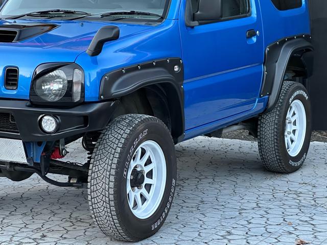 ジムニー XC 【1年間走行無制限保証】5MT/フルカスタム車両(エアロ・2本出しマフラー・スキッドプレート・リフトアップ・ブリスターフェンダー・LEDテール・シートカバー・アルミホイール・ヘッドライトカバー)(51枚目)