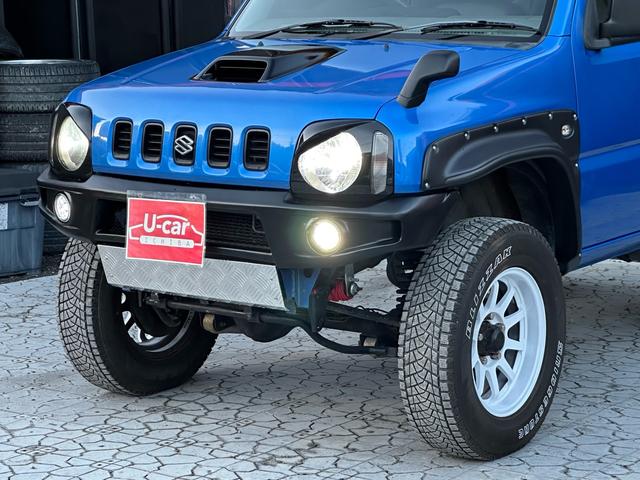ジムニー XC 【1年間走行無制限保証】5MT/フルカスタム車両(エアロ・2本出しマフラー・スキッドプレート・リフトアップ・ブリスターフェンダー・LEDテール・シートカバー・アルミホイール・ヘッドライトカバー)(54枚目)