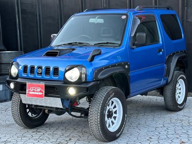 ジムニー XC 【1年間走行無制限保証】5MT/フルカスタム車両(エアロ・2本出しマフラー・スキッドプレート・リフトアップ・ブリスターフェンダー・LEDテール・シートカバー・アルミホイール・ヘッドライトカバー)(56枚目)