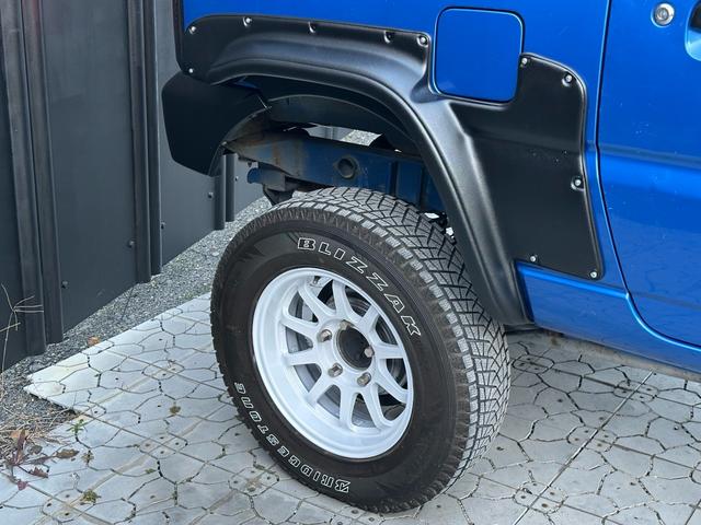 ジムニー XC 【1年間走行無制限保証】5MT/フルカスタム車両(エアロ・2本出しマフラー・スキッドプレート・リフトアップ・ブリスターフェンダー・LEDテール・シートカバー・アルミホイール・ヘッドライトカバー)(58枚目)