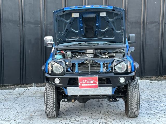 ジムニー XC 【1年間走行無制限保証】5MT/フルカスタム車両(エアロ・2本出しマフラー・スキッドプレート・リフトアップ・ブリスターフェンダー・LEDテール・シートカバー・アルミホイール・ヘッドライトカバー)(62枚目)