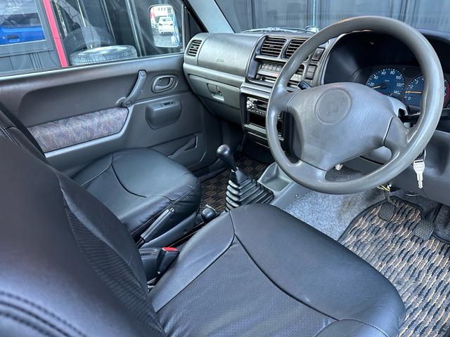 ジムニー XC 【1年間走行無制限保証】5MT/フルカスタム車両(エアロ・2本出しマフラー・スキッドプレート・リフトアップ・ブリスターフェンダー・LEDテール・シートカバー・アルミホイール・ヘッドライトカバー)(74枚目)