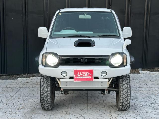 ジムニー Ｊ２　【１年間走行無制限保証】／ＴＡＮＩＧＵＣＨＩコンプリート車両（エアロ・マフラー・スキッドプレート・リフトアップ）／ブリスターフェンダー／ＬＥＤテール／１６インチ／ラギッドテレーン（ＴＯＹＯ）（11枚目）