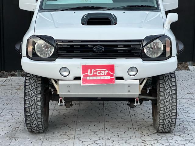 ジムニー Ｊ２　【１年間走行無制限保証】／ＴＡＮＩＧＵＣＨＩコンプリート車両（エアロ・マフラー・スキッドプレート・リフトアップ）／ブリスターフェンダー／ＬＥＤテール／１６インチ／ラギッドテレーン（ＴＯＹＯ）（12枚目）