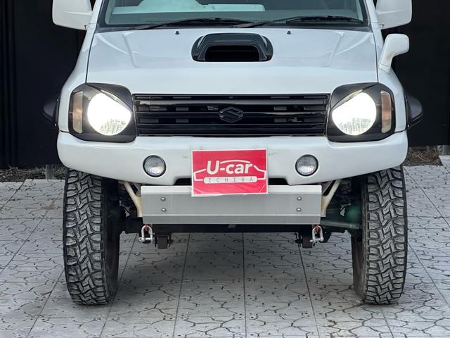 ジムニー Ｊ２　【１年間走行無制限保証】／ＴＡＮＩＧＵＣＨＩコンプリート車両（エアロ・マフラー・スキッドプレート・リフトアップ）／ブリスターフェンダー／ＬＥＤテール／１６インチ／ラギッドテレーン（ＴＯＹＯ）（13枚目）