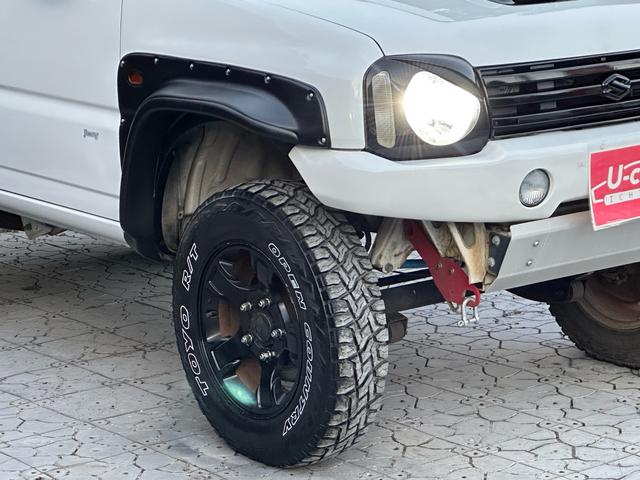 ジムニー Ｊ２　【１年間走行無制限保証】／ＴＡＮＩＧＵＣＨＩコンプリート車両（エアロ・マフラー・スキッドプレート・リフトアップ）／ブリスターフェンダー／ＬＥＤテール／１６インチ／ラギッドテレーン（ＴＯＹＯ）（17枚目）