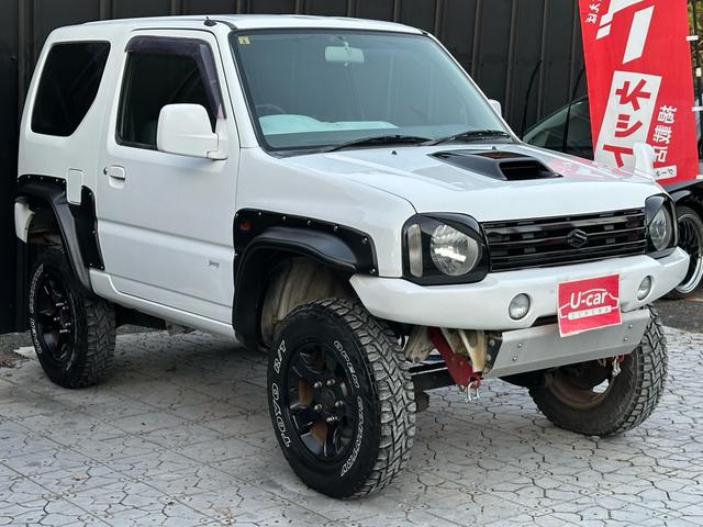 ジムニー Ｊ２　【１年間走行無制限保証】／ＴＡＮＩＧＵＣＨＩコンプリート車両（エアロ・マフラー・スキッドプレート・リフトアップ）／ブリスターフェンダー／ＬＥＤテール／１６インチ／ラギッドテレーン（ＴＯＹＯ）（20枚目）