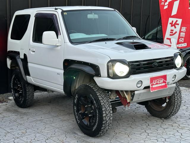 ジムニー Ｊ２　【１年間走行無制限保証】／ＴＡＮＩＧＵＣＨＩコンプリート車両（エアロ・マフラー・スキッドプレート・リフトアップ）／ブリスターフェンダー／ＬＥＤテール／１６インチ／ラギッドテレーン（ＴＯＹＯ）（21枚目）