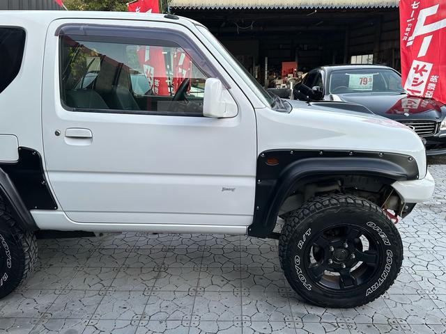 ジムニー Ｊ２　【１年間走行無制限保証】／ＴＡＮＩＧＵＣＨＩコンプリート車両（エアロ・マフラー・スキッドプレート・リフトアップ）／ブリスターフェンダー／ＬＥＤテール／１６インチ／ラギッドテレーン（ＴＯＹＯ）（22枚目）