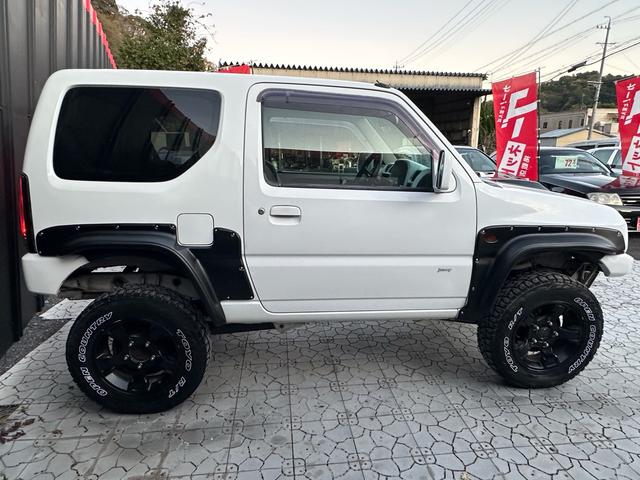 ジムニー Ｊ２　【１年間走行無制限保証】／ＴＡＮＩＧＵＣＨＩコンプリート車両（エアロ・マフラー・スキッドプレート・リフトアップ）／ブリスターフェンダー／ＬＥＤテール／１６インチ／ラギッドテレーン（ＴＯＹＯ）（24枚目）