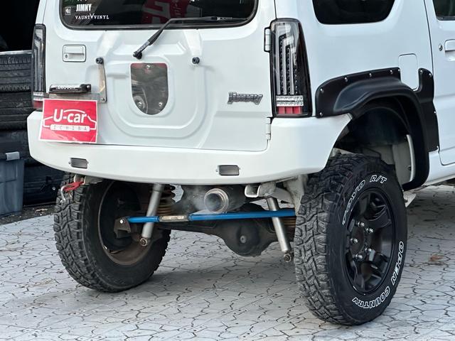 ジムニー Ｊ２　【１年間走行無制限保証】／ＴＡＮＩＧＵＣＨＩコンプリート車両（エアロ・マフラー・スキッドプレート・リフトアップ）／ブリスターフェンダー／ＬＥＤテール／１６インチ／ラギッドテレーン（ＴＯＹＯ）（29枚目）