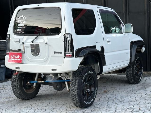 ジムニー Ｊ２　【１年間走行無制限保証】／ＴＡＮＩＧＵＣＨＩコンプリート車両（エアロ・マフラー・スキッドプレート・リフトアップ）／ブリスターフェンダー／ＬＥＤテール／１６インチ／ラギッドテレーン（ＴＯＹＯ）（31枚目）