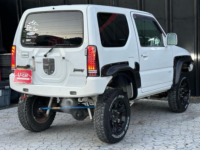 ジムニー Ｊ２　【１年間走行無制限保証】／ＴＡＮＩＧＵＣＨＩコンプリート車両（エアロ・マフラー・スキッドプレート・リフトアップ）／ブリスターフェンダー／ＬＥＤテール／１６インチ／ラギッドテレーン（ＴＯＹＯ）（32枚目）