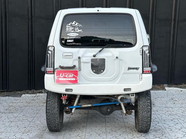 ジムニー Ｊ２　【１年間走行無制限保証】／ＴＡＮＩＧＵＣＨＩコンプリート車両（エアロ・マフラー・スキッドプレート・リフトアップ）／ブリスターフェンダー／ＬＥＤテール／１６インチ／ラギッドテレーン（ＴＯＹＯ）（33枚目）