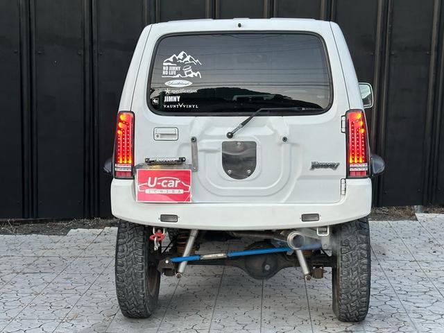 ジムニー Ｊ２　【１年間走行無制限保証】／ＴＡＮＩＧＵＣＨＩコンプリート車両（エアロ・マフラー・スキッドプレート・リフトアップ）／ブリスターフェンダー／ＬＥＤテール／１６インチ／ラギッドテレーン（ＴＯＹＯ）（34枚目）