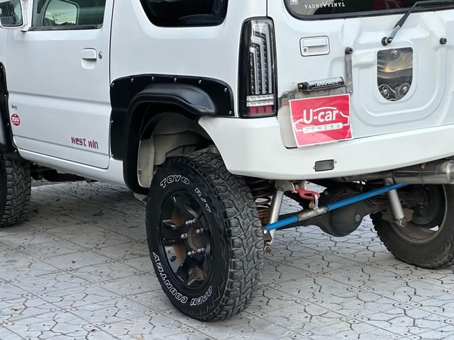 ジムニー Ｊ２　【１年間走行無制限保証】／ＴＡＮＩＧＵＣＨＩコンプリート車両（エアロ・マフラー・スキッドプレート・リフトアップ）／ブリスターフェンダー／ＬＥＤテール／１６インチ／ラギッドテレーン（ＴＯＹＯ）（43枚目）