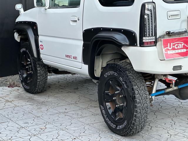 ジムニー Ｊ２　【１年間走行無制限保証】／ＴＡＮＩＧＵＣＨＩコンプリート車両（エアロ・マフラー・スキッドプレート・リフトアップ）／ブリスターフェンダー／ＬＥＤテール／１６インチ／ラギッドテレーン（ＴＯＹＯ）（45枚目）