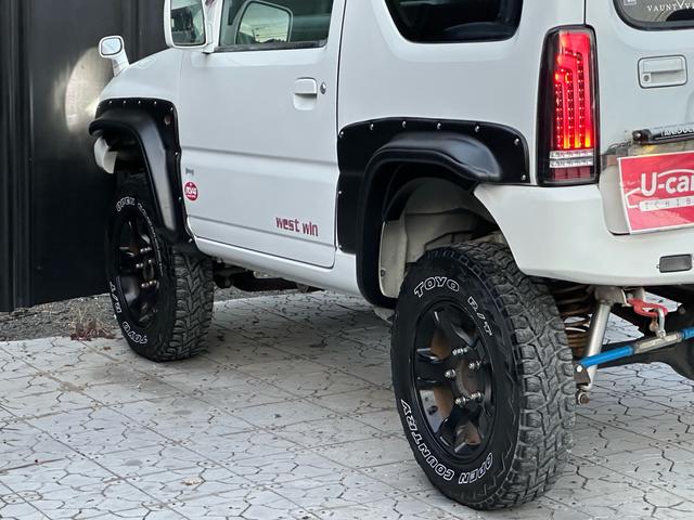 ジムニー Ｊ２　【１年間走行無制限保証】／ＴＡＮＩＧＵＣＨＩコンプリート車両（エアロ・マフラー・スキッドプレート・リフトアップ）／ブリスターフェンダー／ＬＥＤテール／１６インチ／ラギッドテレーン（ＴＯＹＯ）（46枚目）