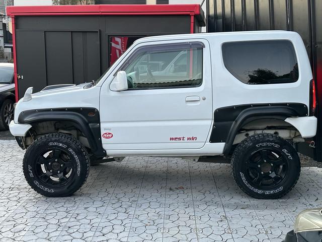 ジムニー Ｊ２　【１年間走行無制限保証】／ＴＡＮＩＧＵＣＨＩコンプリート車両（エアロ・マフラー・スキッドプレート・リフトアップ）／ブリスターフェンダー／ＬＥＤテール／１６インチ／ラギッドテレーン（ＴＯＹＯ）（47枚目）