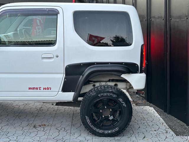 ジムニー Ｊ２　【１年間走行無制限保証】／ＴＡＮＩＧＵＣＨＩコンプリート車両（エアロ・マフラー・スキッドプレート・リフトアップ）／ブリスターフェンダー／ＬＥＤテール／１６インチ／ラギッドテレーン（ＴＯＹＯ）（48枚目）