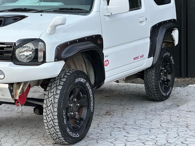 ジムニー Ｊ２　【１年間走行無制限保証】／ＴＡＮＩＧＵＣＨＩコンプリート車両（エアロ・マフラー・スキッドプレート・リフトアップ）／ブリスターフェンダー／ＬＥＤテール／１６インチ／ラギッドテレーン（ＴＯＹＯ）（51枚目）