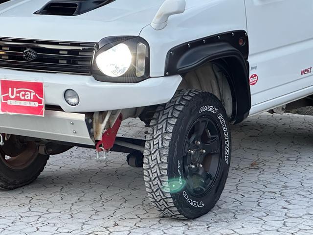 ジムニー Ｊ２　【１年間走行無制限保証】／ＴＡＮＩＧＵＣＨＩコンプリート車両（エアロ・マフラー・スキッドプレート・リフトアップ）／ブリスターフェンダー／ＬＥＤテール／１６インチ／ラギッドテレーン（ＴＯＹＯ）（54枚目）