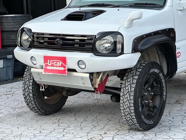 ジムニー Ｊ２　【１年間走行無制限保証】／ＴＡＮＩＧＵＣＨＩコンプリート車両（エアロ・マフラー・スキッドプレート・リフトアップ）／ブリスターフェンダー／ＬＥＤテール／１６インチ／ラギッドテレーン（ＴＯＹＯ）（55枚目）