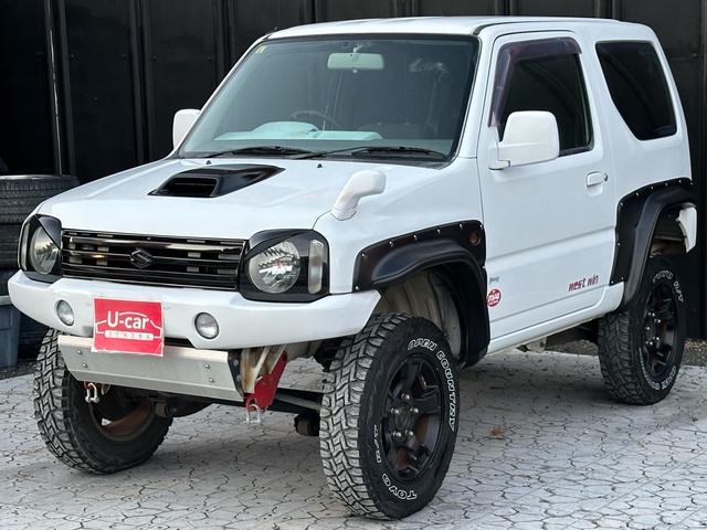 ジムニー Ｊ２　【１年間走行無制限保証】／ＴＡＮＩＧＵＣＨＩコンプリート車両（エアロ・マフラー・スキッドプレート・リフトアップ）／ブリスターフェンダー／ＬＥＤテール／１６インチ／ラギッドテレーン（ＴＯＹＯ）（57枚目）