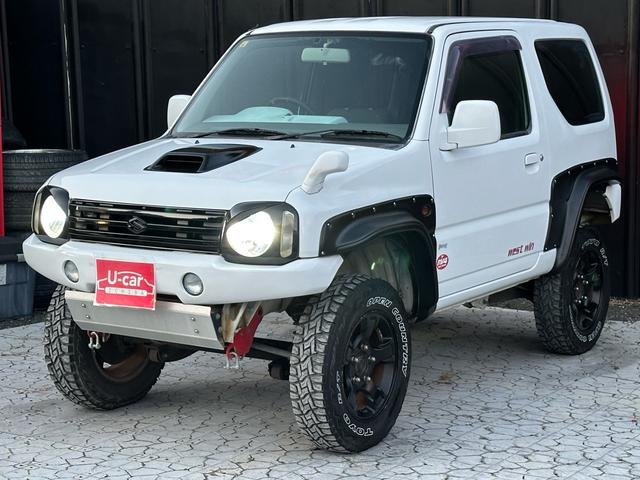 ジムニー Ｊ２　【１年間走行無制限保証】／ＴＡＮＩＧＵＣＨＩコンプリート車両（エアロ・マフラー・スキッドプレート・リフトアップ）／ブリスターフェンダー／ＬＥＤテール／１６インチ／ラギッドテレーン（ＴＯＹＯ）（58枚目）