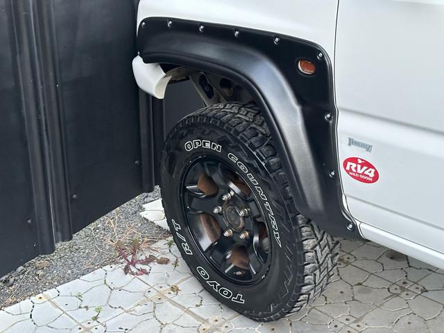 ジムニー Ｊ２　【１年間走行無制限保証】／ＴＡＮＩＧＵＣＨＩコンプリート車両（エアロ・マフラー・スキッドプレート・リフトアップ）／ブリスターフェンダー／ＬＥＤテール／１６インチ／ラギッドテレーン（ＴＯＹＯ）（60枚目）