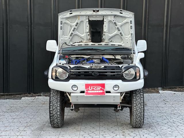 ジムニー Ｊ２　【１年間走行無制限保証】／ＴＡＮＩＧＵＣＨＩコンプリート車両（エアロ・マフラー・スキッドプレート・リフトアップ）／ブリスターフェンダー／ＬＥＤテール／１６インチ／ラギッドテレーン（ＴＯＹＯ）（63枚目）