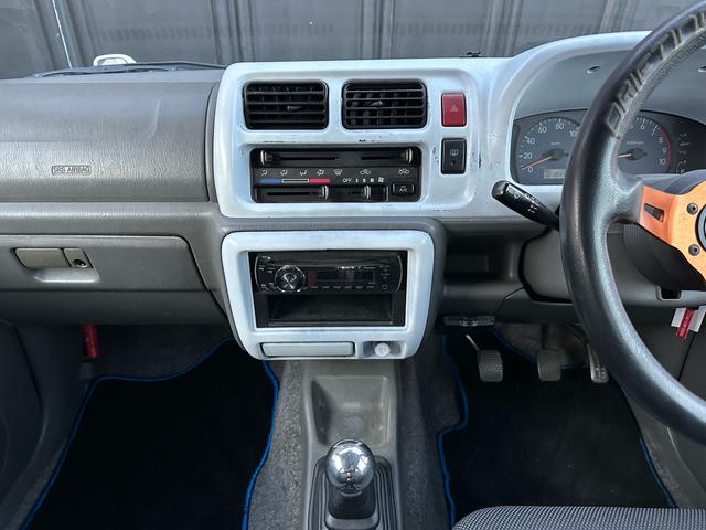 ジムニー Ｊ２　【１年間走行無制限保証】／ＴＡＮＩＧＵＣＨＩコンプリート車両（エアロ・マフラー・スキッドプレート・リフトアップ）／ブリスターフェンダー／ＬＥＤテール／１６インチ／ラギッドテレーン（ＴＯＹＯ）（66枚目）