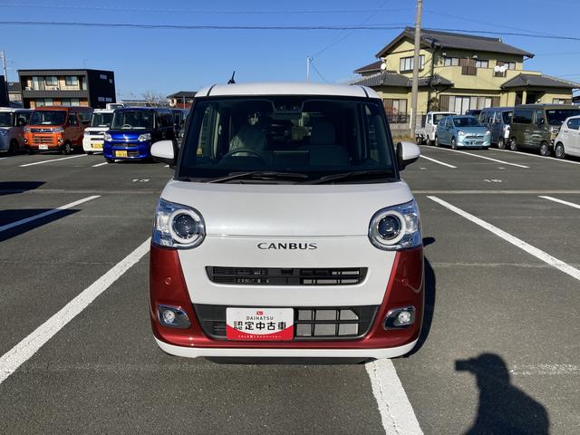 ムーヴキャンバス ストライプスGターボ 14インチフルホイールキャップ キーフリーシステム プッシュボタンスタート UVカットガラス 両側パワースライドドア ハロゲンヘッドライト ラゲージアンダーボックス(2枚目)