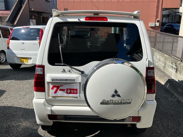 パジェロミニ アクティブフィールドエディション 4WD HDDナビ Rスポイラー 純正アルミホイール 電動格納ミラー キーレスエントリー 背面タイヤカバー 車検9年10月(5枚目)