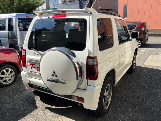 パジェロミニ アクティブフィールドエディション 4WD HDDナビ Rスポイラー 純正アルミホイール 電動格納ミラー キーレスエントリー 背面タイヤカバー 車検9年10月(6枚目)