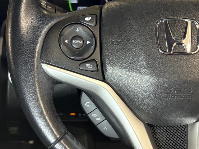 フィットハイブリッド Ｌパッケージ　ナビフルセグＢカメラＥＴＣＬＥＤＡＷ　ナビ＆ＴＶ　地デジフルセグＴＶ　ＵＳＢ　サイドエアバック　ＤＶＤ再生　バックカメラ　オートクルーズコントロール　ＥＳＣ　ＡＵＴＯエアコン　ＡＢＳ　運転席エアバック（22枚目）