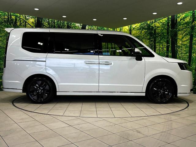 ステップワゴン ｅ：ＨＥＶスパーダ　登録済未使用車　両側電動ドア　バックカメラ　衝突被害軽減システム　レーダークルーズ　電動リアゲート　ハーフレザーシート　コーナーセンサー　スマートキー　ＬＥＤヘッド　オートハイビーム　車線逸脱警報（28枚目）