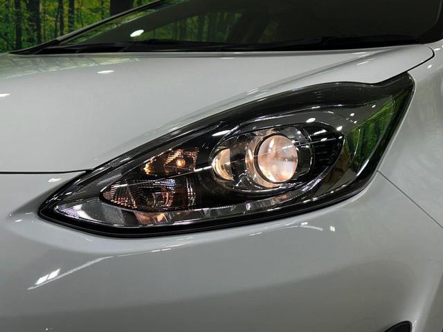 アクア L ナビゲーション バックカメラ セーフティセンス 禁煙車 ETC2.0 オートライト オートエアコン Bluetooth CD・DVD再生 電動格納ミラー ドアバイザー プライバシーガラス スマートキー(12枚目)