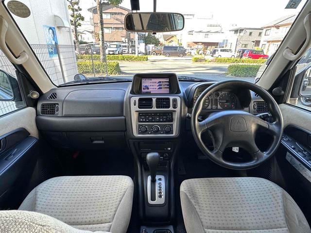 パジェロイオ パールパッケージＩＩ　ナビエディション　１．５インチリフトアップ　ブラックアウト　オーバーフェンダー　社外１６インチＡＷ　インナーブラック　Ｆフォグランプ　背面タイヤ　純正モニター　ＥＴＣ　ＡＡＣ　ＰＳ　ＰＷ　分割可倒式Ｒシート　電格ミラー（2枚目）