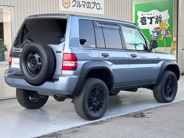 パジェロイオ パールパッケージＩＩ　ナビエディション　１．５インチリフトアップ　ブラックアウト　オーバーフェンダー　社外１６インチＡＷ　インナーブラック　Ｆフォグランプ　背面タイヤ　純正モニター　ＥＴＣ　ＡＡＣ　ＰＳ　ＰＷ　分割可倒式Ｒシート　電格ミラー（18枚目）