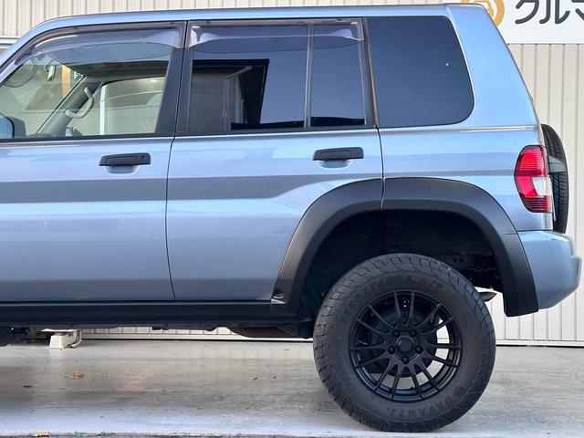 パジェロイオ パールパッケージＩＩ　ナビエディション　１．５インチリフトアップ　ブラックアウト　オーバーフェンダー　社外１６インチＡＷ　インナーブラック　Ｆフォグランプ　背面タイヤ　純正モニター　ＥＴＣ　ＡＡＣ　ＰＳ　ＰＷ　分割可倒式Ｒシート　電格ミラー（30枚目）