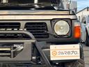 グランロード　走行６万キロ　ディーゼル　リフトアップ　グリルガード　電動ウインチ　ＧＥＯＬＡＮＤＡＲ　Ｍ／Ｔタイヤ　１５インチアルミホイール　オーバーフェンダー　サイドステップ　ナビ　背面タイヤ　集中ドアロック（39枚目）