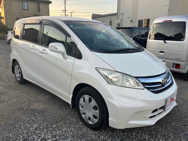 フリード G ジャストセレクション ETC 両側スライド・片側電動 スマートキー 電動格納ミラー CVT CD USB 盗難防止システム 衝突安全ボディ ABS ESC エアコン パワーステアリング(15枚目)