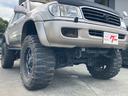 ランドクルーザー１００ ＶＸリミテッド　Ｇセレクション　１ナンバー登録　走行５．５万キロ　４ＷＤ　リフトアップ　アクティブコントローラー　サンルーフ　本革　パワーシート　社外マフラー　テール　オーバーフェンダー　アルミホイール（7枚目）