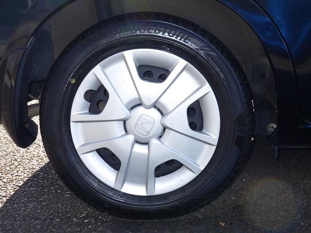 フィットハイブリッド ハイブリッド・１０ｔｈアニバーサリー　１年保証付　純正ＨＤＤナビ　ワンセグＴＶ　バックカメラ　ＥＴＣ　ＣＤ・ＤＶＤ再生　ラジオ　ステアリングスイッチ　クルーズコントロール　スマートキー　ＨＩＤヘッドライト　オートライト　オートエアコン（50枚目）