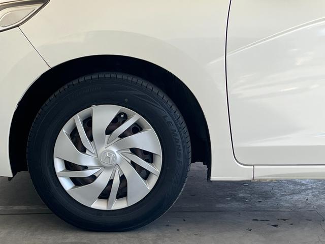 フィット １３Ｇ・Ｆパッケージ　保証付き１年　イモビ　ＤＶＤ再生可能　スマ－トキ－　記録簿有り　ＶＳＡ　ＥＴＣ付き　助手席エアバッグ　Ｒカメラ　オートエアコン　ＵＳＢ接続　エアバック　ＰＳ　キ－フリ－　１セグ　ＰＷ　ＡＢＳ　ＴＶナビ（50枚目）