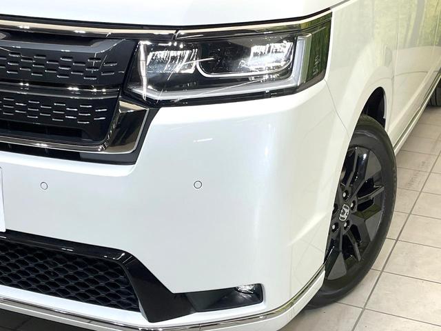 ステップワゴン ｅ：ＨＥＶスパーダ　登録済未使用車　純正１１．４型ナビ　バックモニター　ホンダセンシング　両側パワスラ　ＢＳＭ　レーダークルーズ　オットマンシート　リアオートエアコン　オートエアコン　シートヒーター　パワーバックドア（13枚目）