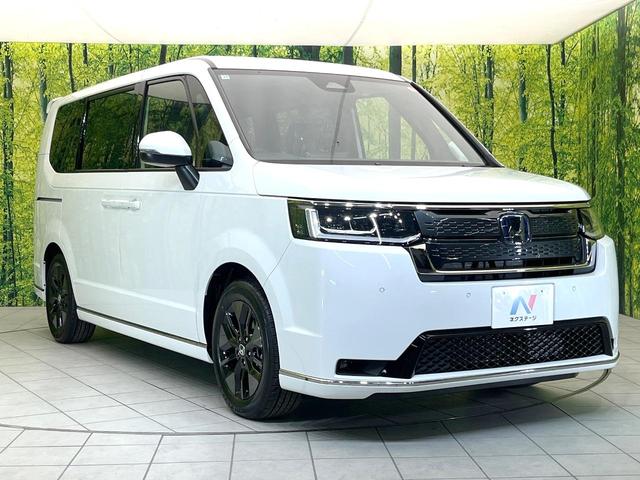 ステップワゴン ｅ：ＨＥＶスパーダ　登録済未使用車　純正１１．４型ナビ　バックモニター　ホンダセンシング　両側パワスラ　ＢＳＭ　レーダークルーズ　オットマンシート　リアオートエアコン　オートエアコン　シートヒーター　パワーバックドア（17枚目）