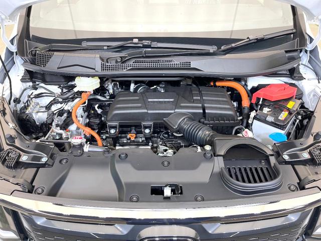 ステップワゴン ｅ：ＨＥＶスパーダ　登録済未使用車　純正１１．４型ナビ　バックモニター　ホンダセンシング　両側パワスラ　ＢＳＭ　レーダークルーズ　オットマンシート　リアオートエアコン　オートエアコン　シートヒーター　パワーバックドア（18枚目）